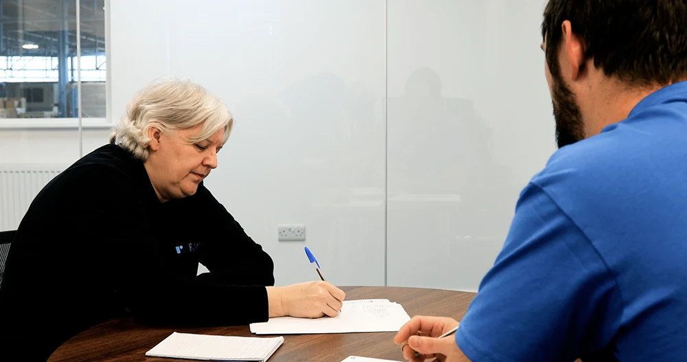 Shirley in a meeting